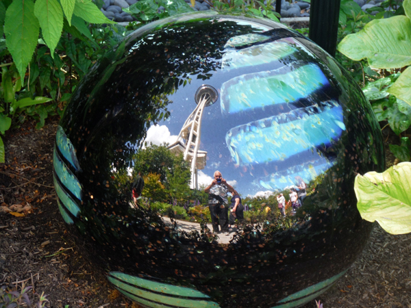 big black ball that shows the reflections of photographers